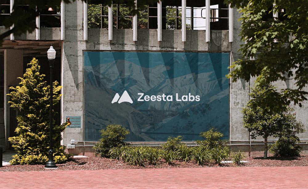 Zeesta Labs logo lockup rendered onto an outside wall poster